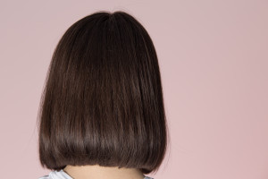 Bob hairstyle view from back on pink background